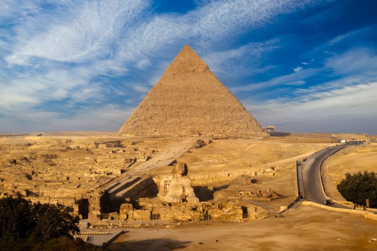 sunset-view-of-pyramid-complex-of-giza-in-cairo-2021-12-21-18-53-10-utc-scaled
